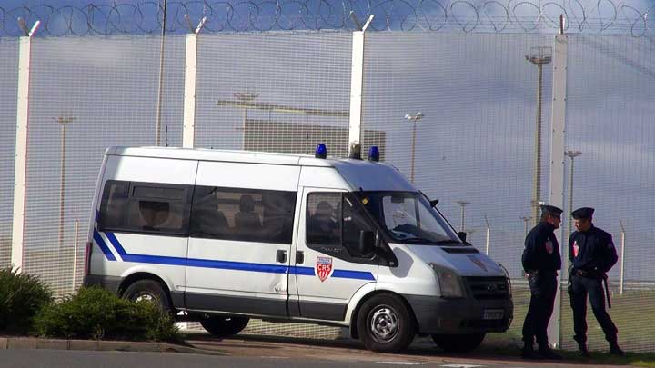 Police patrols near the harbor beside "The Jungle," a massive migrant camp in Calais, France. (VOA/Nicolas Pinault)