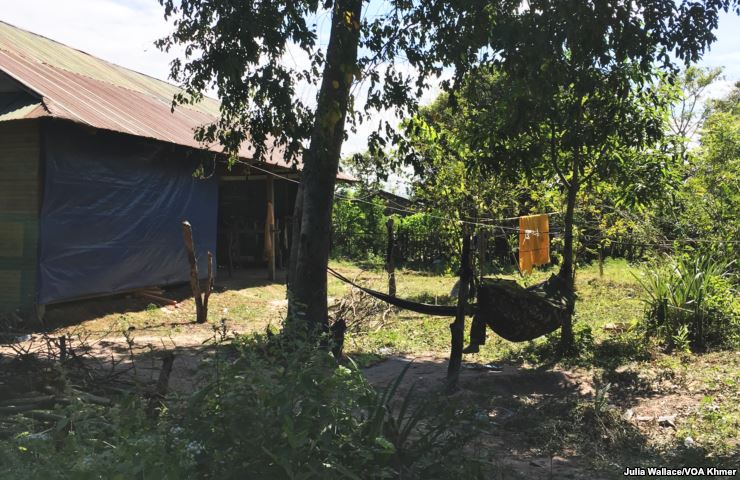 soldier rests in a hammock at the newly established military camp