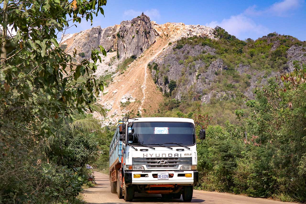 A truck transporting K-cement passes through the road leading up to Totung Mountain