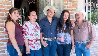 Photo of Estrella and her husband, Hendrin, surrounded by their parents.