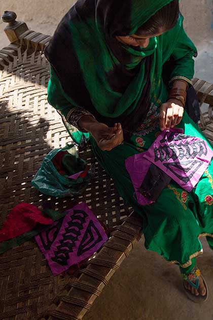 Photo of Qubra producing custom-made embroidery.