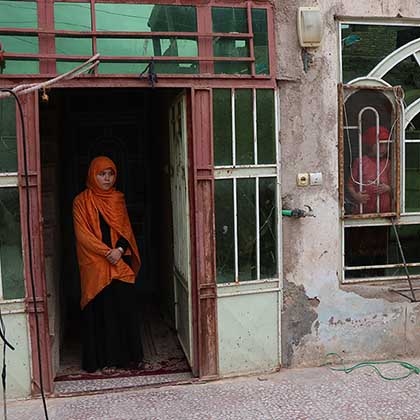 Photo of Somaya standing in a doorway