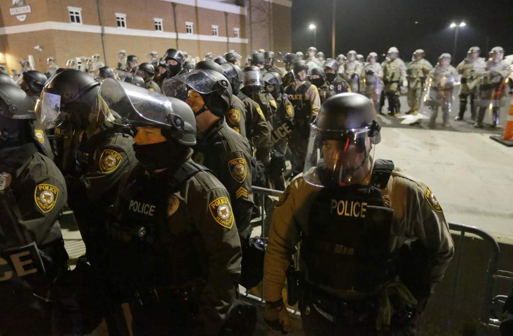 Police outside Ferguson police department: Photo AP