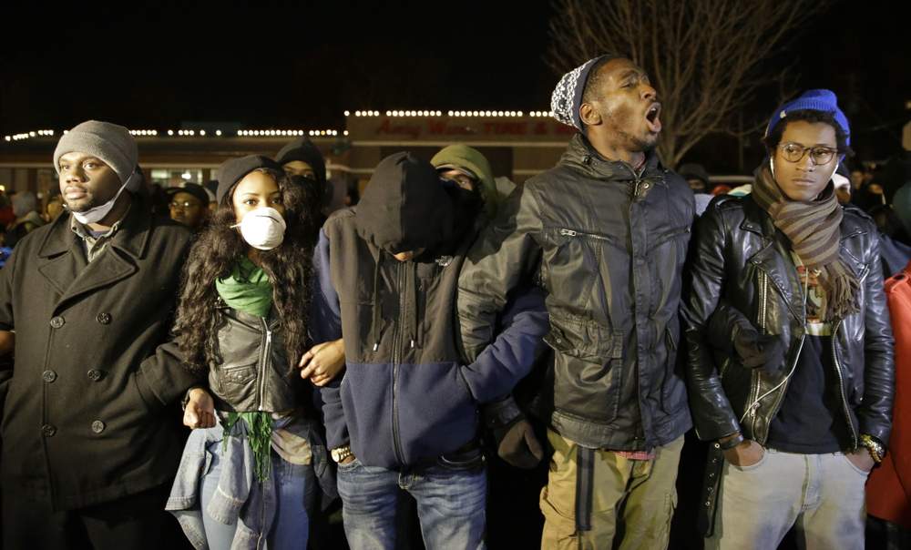 Protestors gather across from Ferguson police department: Photo AP