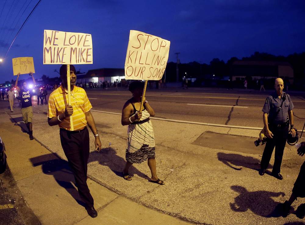 Peaceful protestors walk through Ferguson: Photo AP