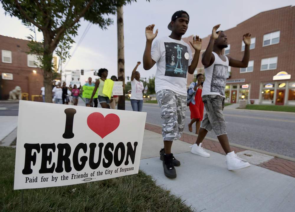 Peaceful protestors walk through Ferguson: Photo AP