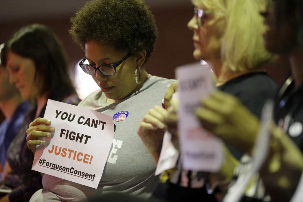 Citizens at city council meeting: Photo AP