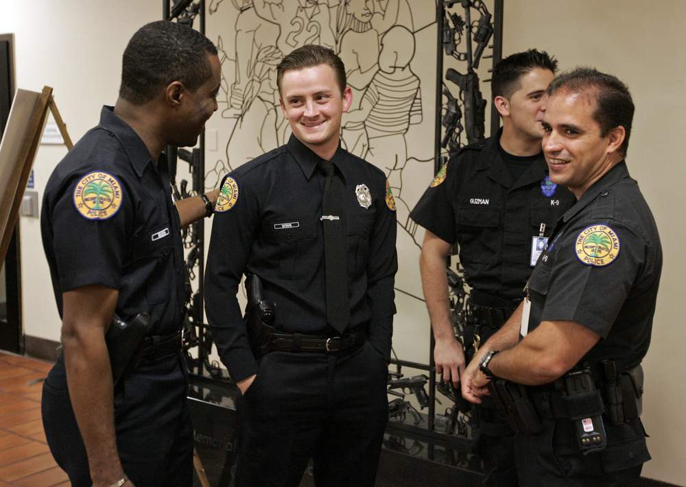 Delrish Moss, Miami Police, far left: Photo AP.