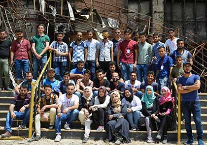 A group of some of the Mosul youth who volunteered to rescue thousands of books among the destruction of Mosul University’s Central Library. 