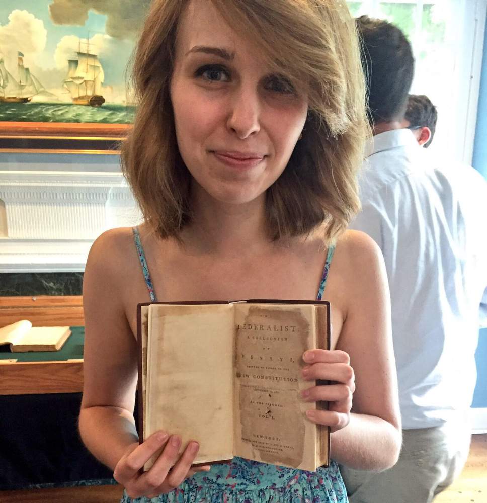 Elle Rogers holds a first-edition copy of The Federalist at the headquarters of the Intercollegiate Studies Institute in Wilmington, Delaware.