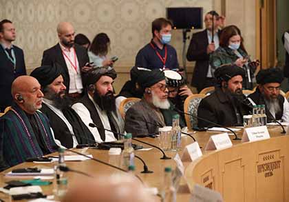 Former Afghan President Hamid Karzai, left, and Taliban co-founder Mullah Abdul Ghani Baradar, second from right, attend an international conference for a peaceful solution to the conflict in Afghanistan, hosted in Moscow in March 2021. 