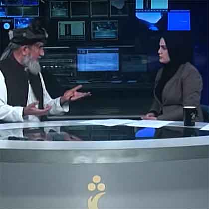 Hosai Ahmadzai interviews a guest on set of Shamshad TV on August 17, 2021.  