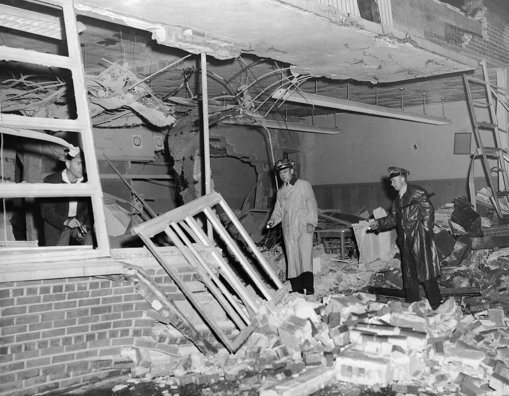 Police examine wreckage of wing of newly desegregated Hattie Cotton grammar school, which was dynamited in Nashville, Tenn., Sept. 10, 1957. Four classrooms were demolished.  (AP Photo)